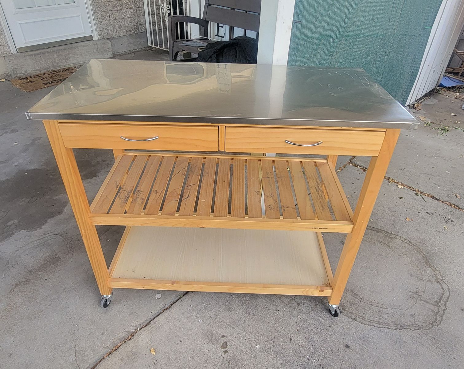 Stainless steel rolling table with locking wheels
