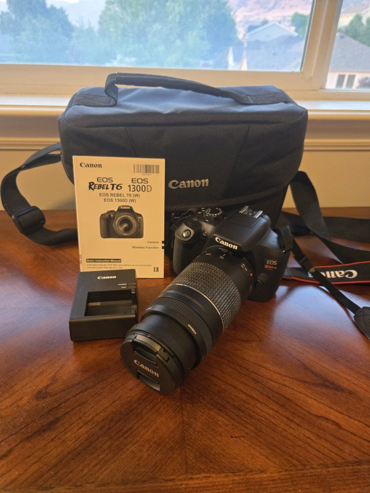 Canon EOS Rebel T6 (1300D) DSLR Camera with Lens, Charger, Manual, and Bag
