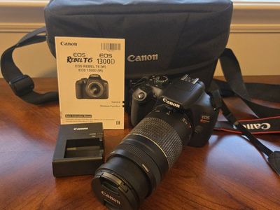 Canon EOS Rebel T6 (1300D) DSLR Camera with Lens, Charger, Manual, and Bag