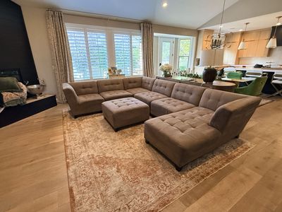 Large sectional sofa with chaise lounge and ottoman.