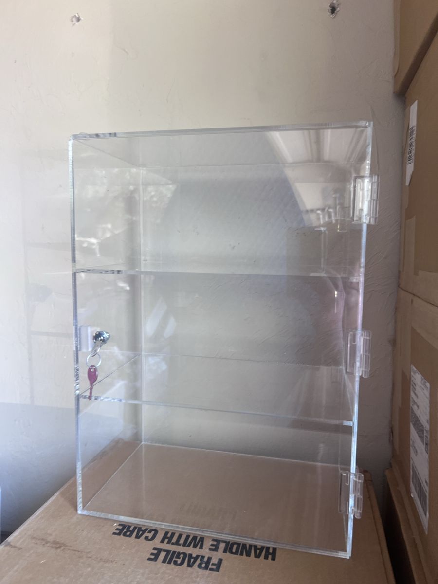 New 3-tier clear acrylic cabinet w/lock & key. $20 each
