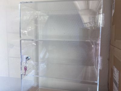 New 3-tier clear acrylic cabinet w/lock & key. $20 each