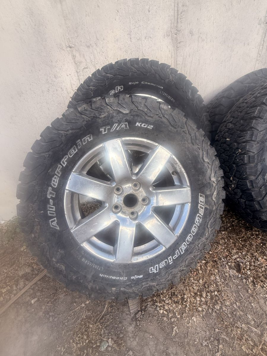 BFGoodrich All-Terrain T/A KO2 LT285/65R18 Tires with Silver Rims - Set of 4