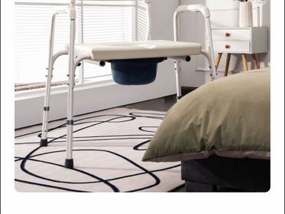 Adjustable bedside commode
