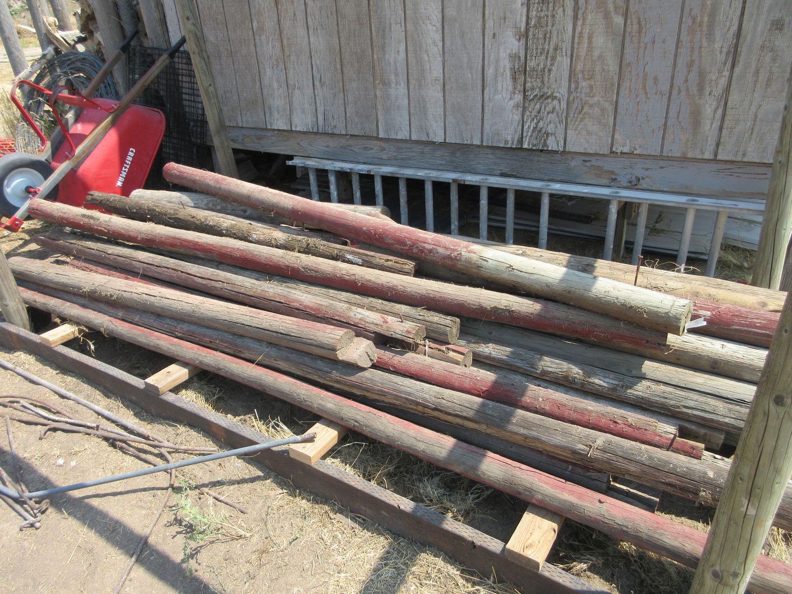 Bundle of Used Wood Fence Posts and Wooden Rails