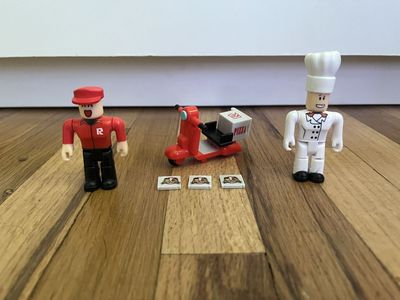Roblox Pizza Delivery & Chef Figure Set with Scooter & Pizza Tiles - RBLX Action Figures / Toy