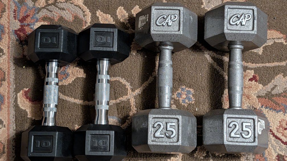 Used workout equipment dumbbells, rebounder