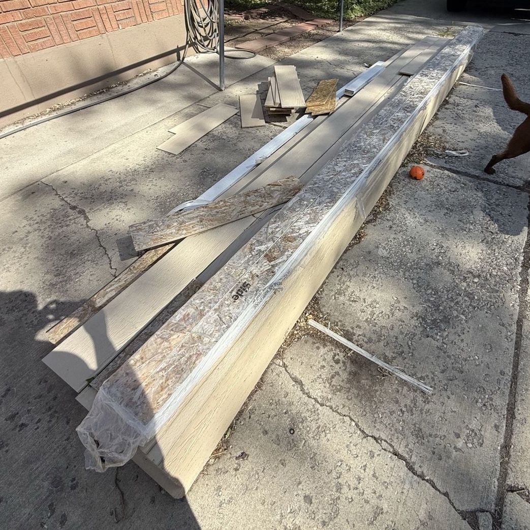 House siding, primed, and white trim, prepainted