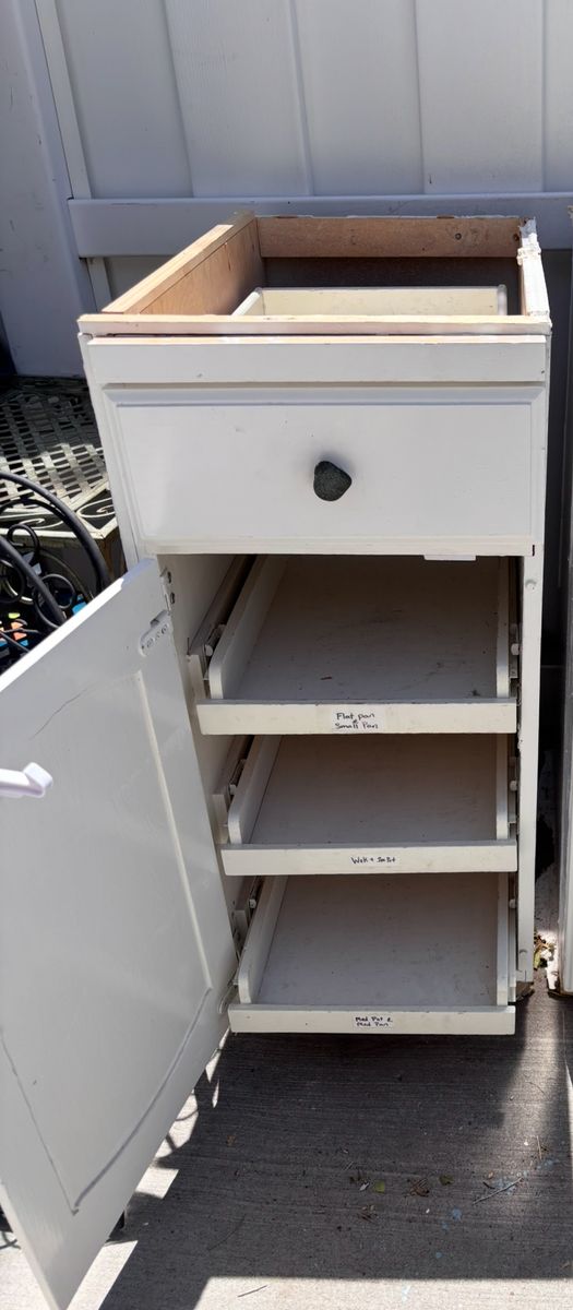 Base cabinet with 3 pull out storage drawers