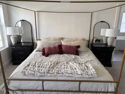Pair of Black Wood 3-Drawer Nightstands with Decorative Brass Pulls and Arched Mirrors