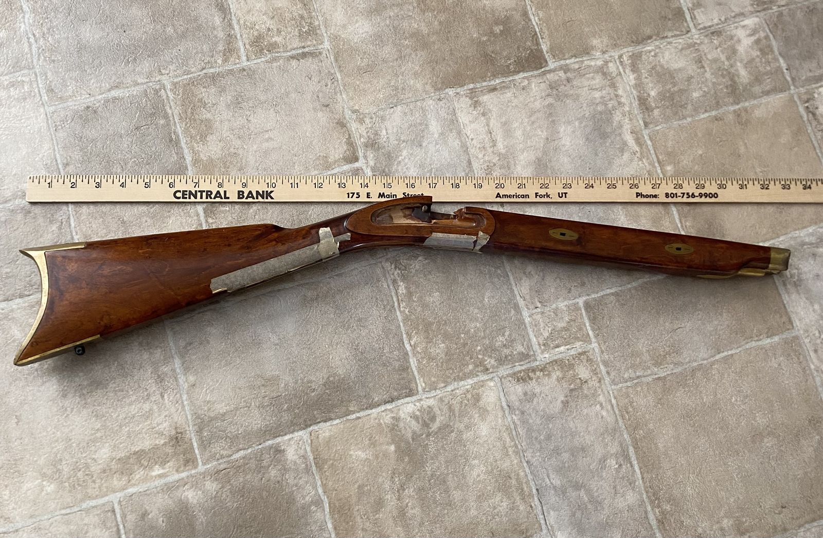 Muzzleloader stock with brass accents