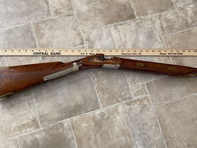 Muzzleloader stock with brass accents