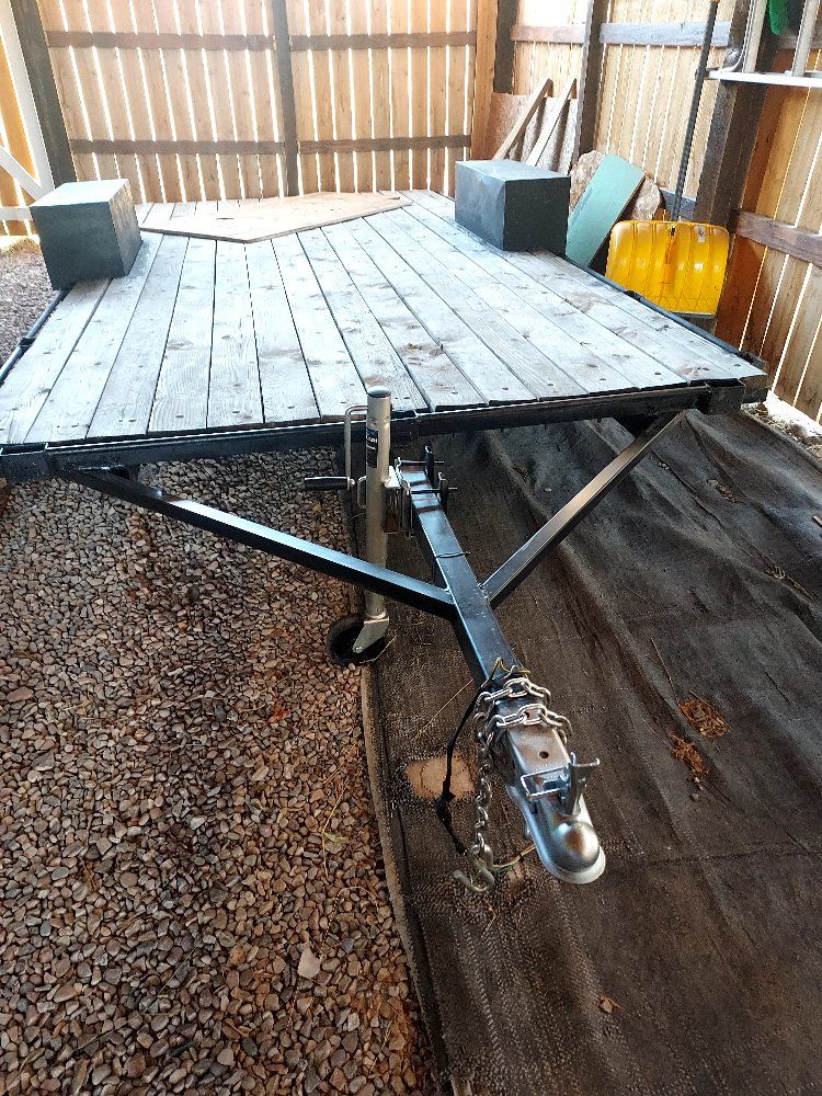 Single-Axle Flatbed Utility Trailer with Wooden Deck and Front Jack