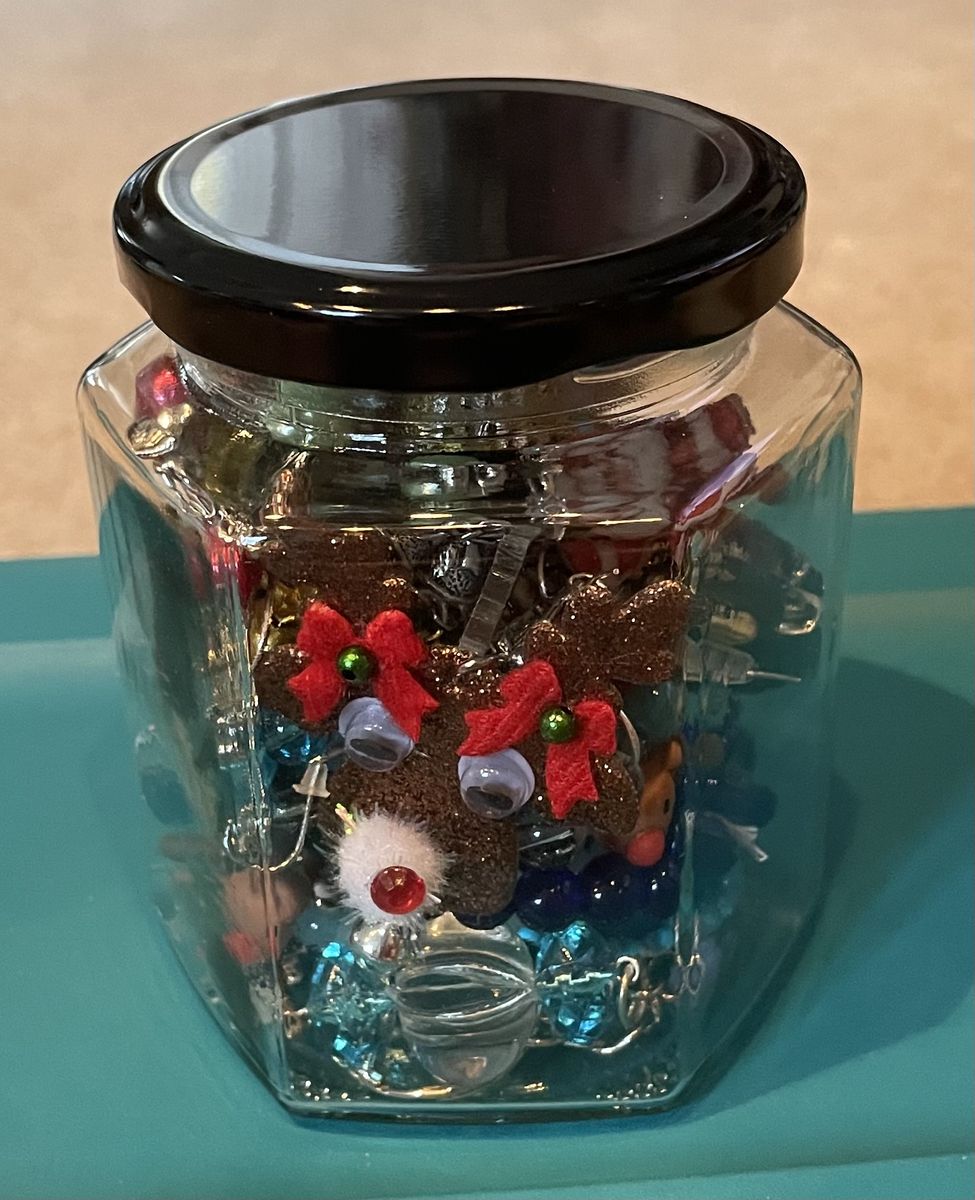 Glass Jar filled with Christmas themed Earrings. necklaces and Bracelets