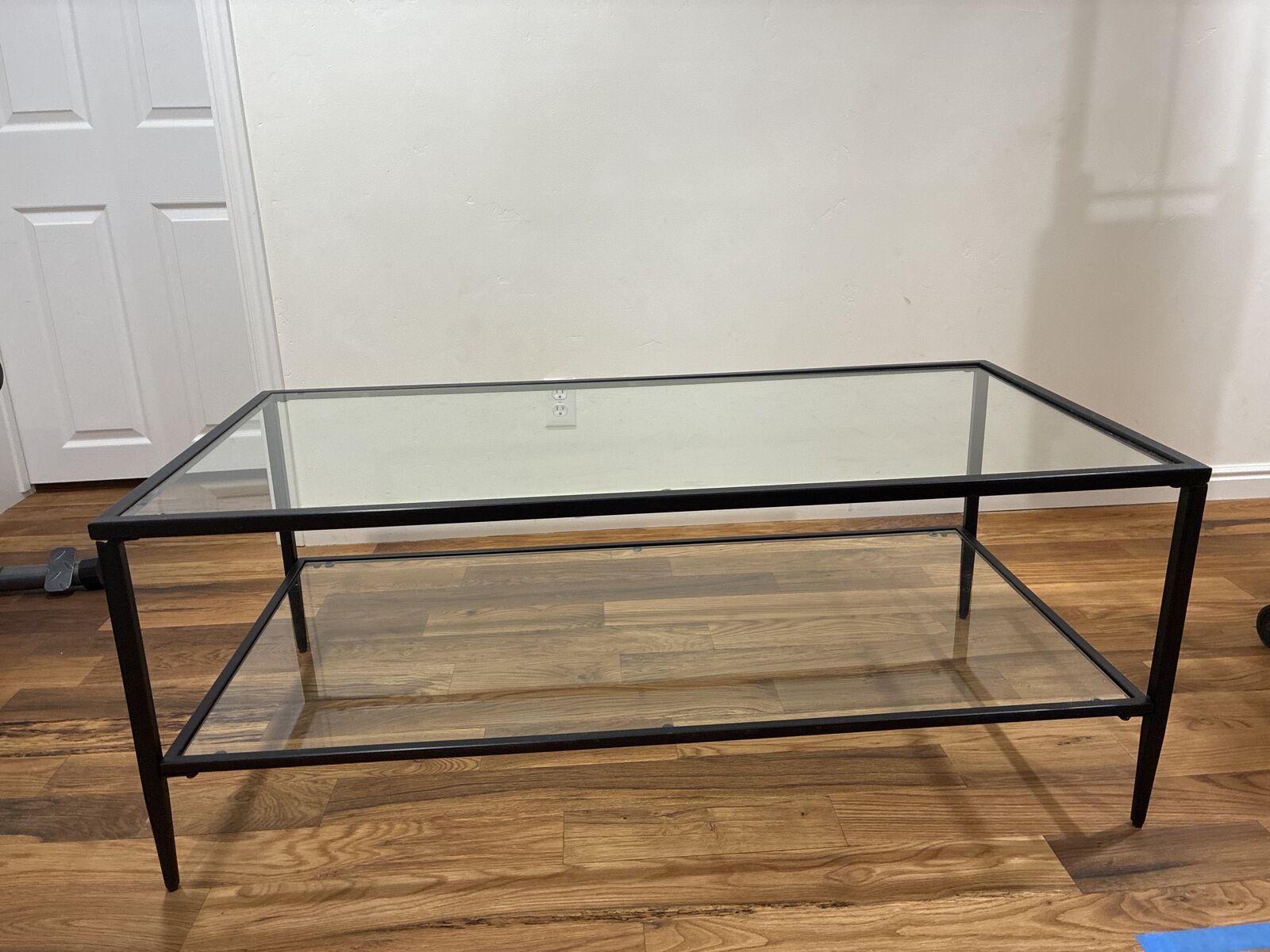Black metal and glass coffee table.