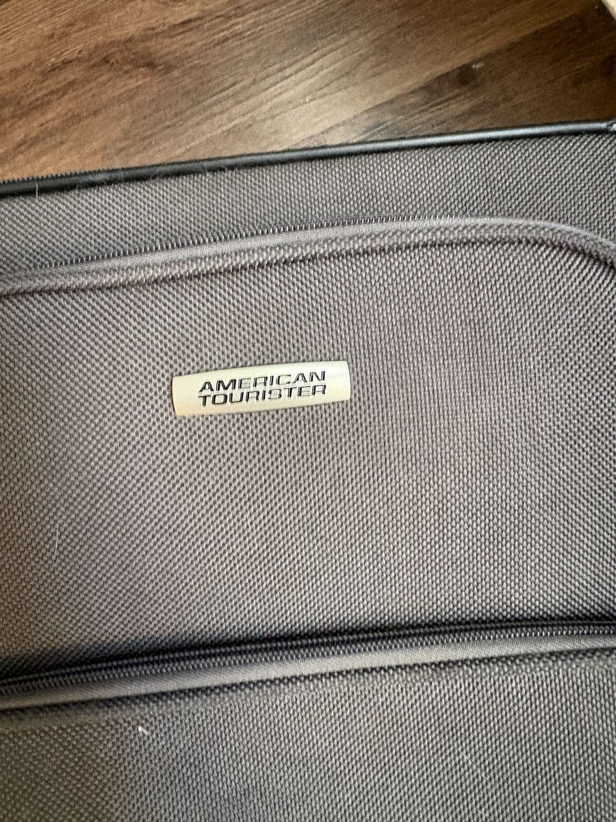 American Tourister Grey Soft-Sided Rolling Carry-On Luggage. suitcase