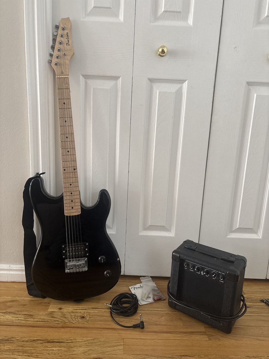 Black electric Davison guitar with Hollinger amp.