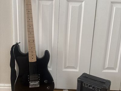 Black electric Davison guitar with Hollinger amp.
