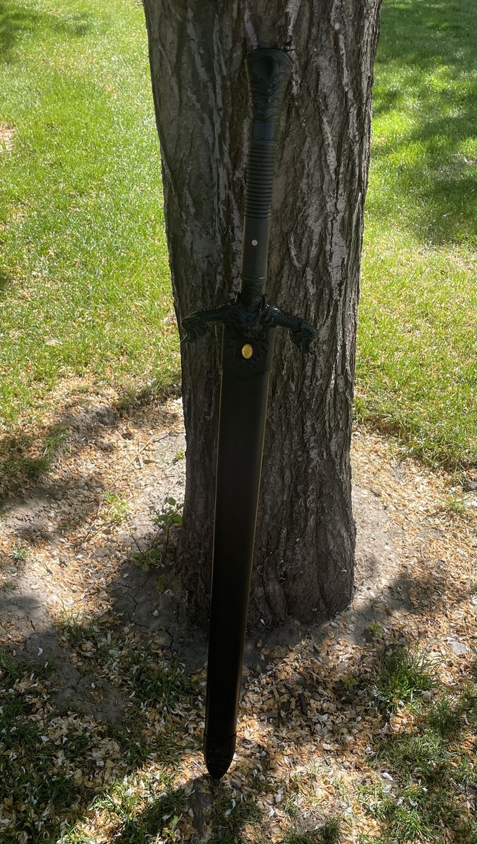 Large black handle Damascus sword