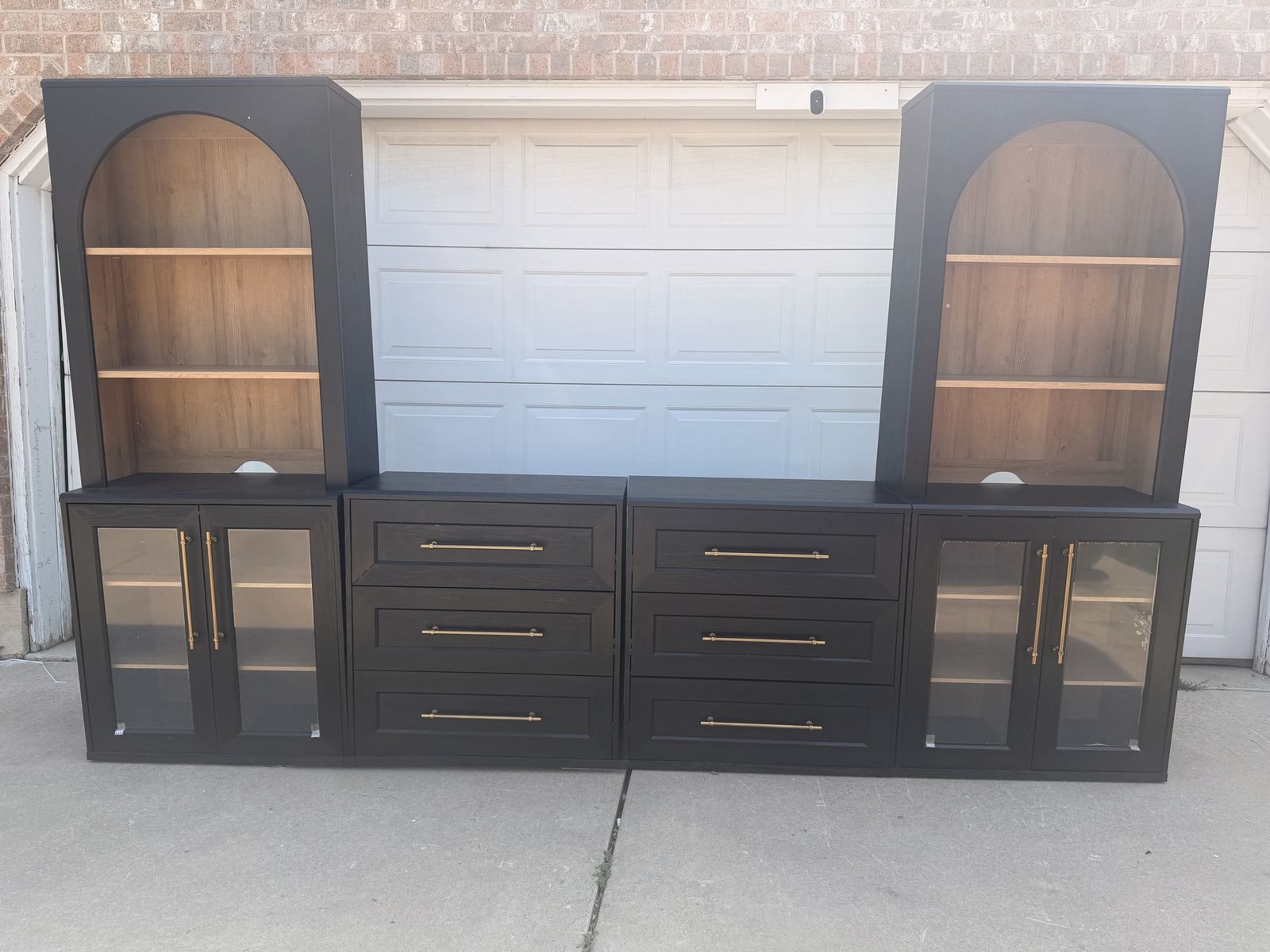 Modern Black Arched Entertainment Center with Bookshelves, Cabinets, and Drawers