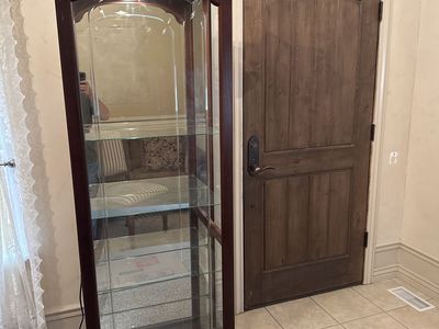 Elegant Wooden Curio Display Cabinet with Glass Shelves and Lighting