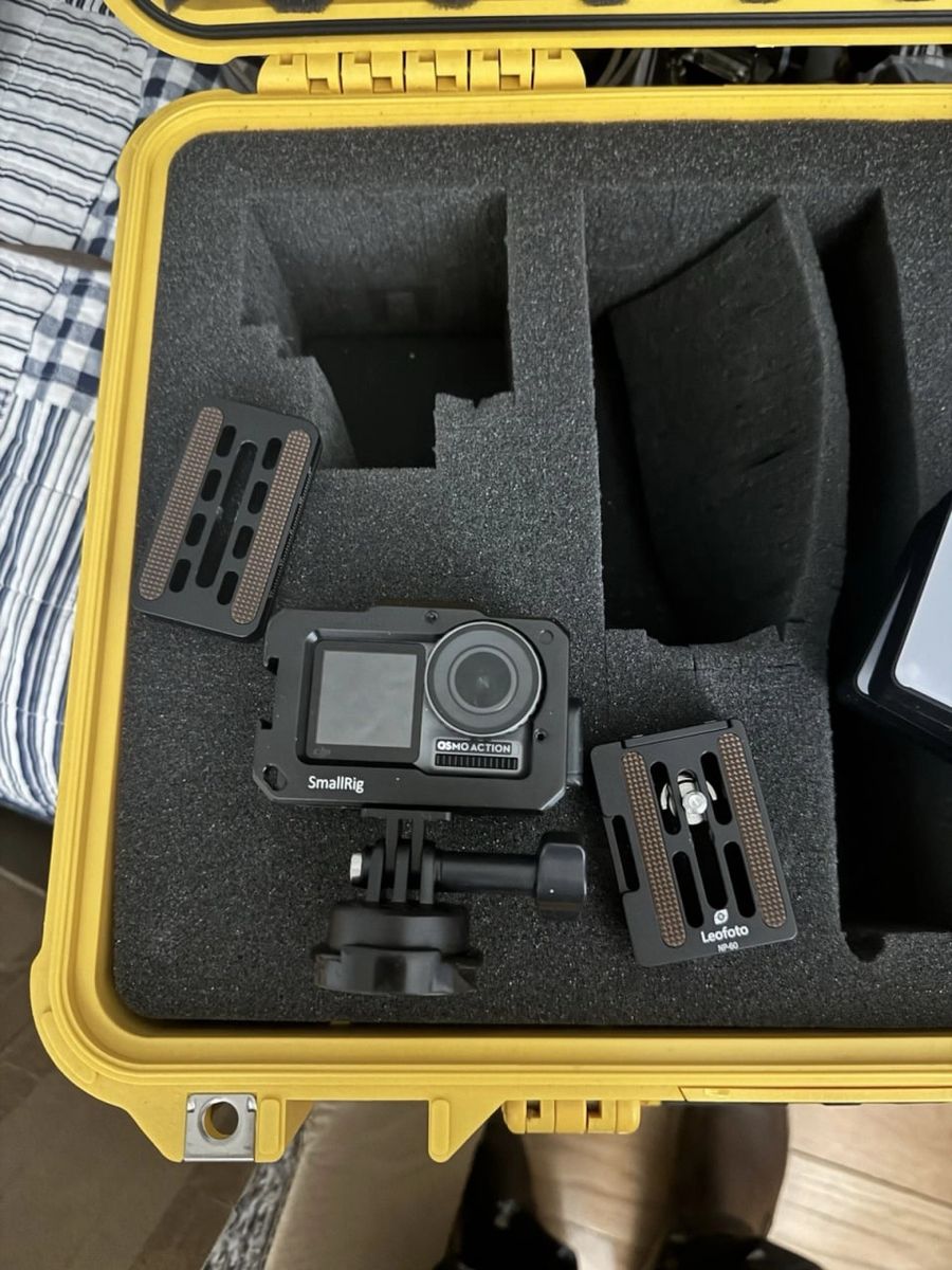 DJI Osmo Action camera with a SmallRig protective case, Rode Boom arm, adjustable lights, and a Pelican case