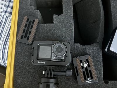 DJI Osmo Action camera with a SmallRig protective case, Rode Boom arm, adjustable lights, and a Pelican case