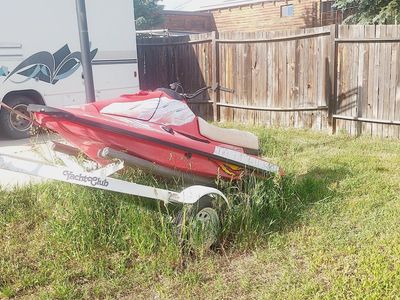 Red Personal Watercraft (PWC) with Yacht Club Trailer
