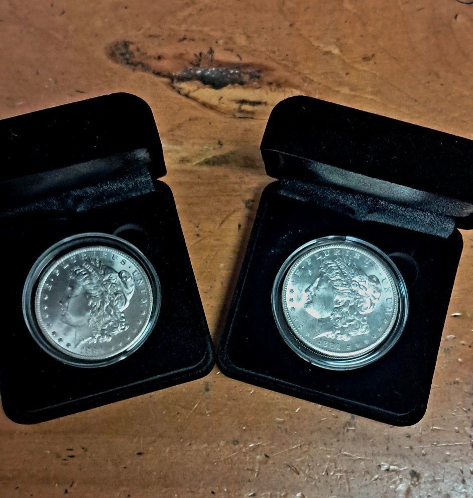 Morgan Silver Dollars in Display Boxes.