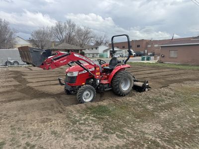 Tiller, Massey Ferguson Tractor 1825E with trailer.