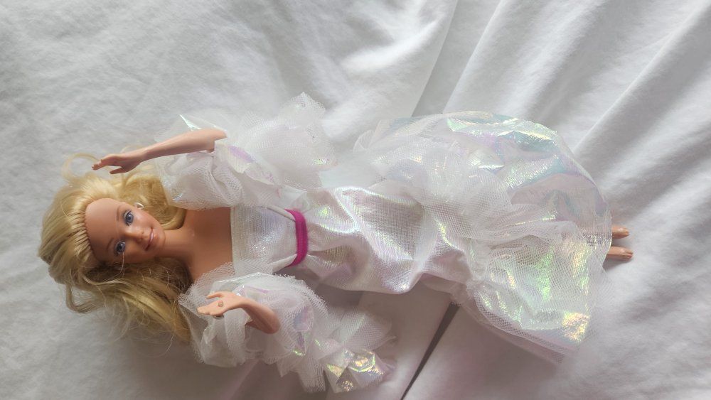 3 vintage Barbies and Ken and box