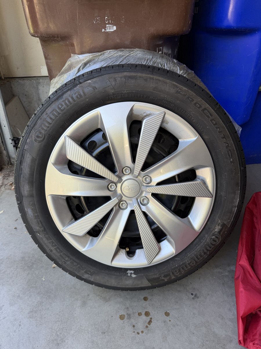 Continental ProContact TX P205/55R16 Tires on Subaru Impreza OEM Rims w/ Hub Caps