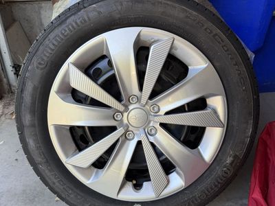 Continental ProContact TX P205/55R16 Tires on Subaru Impreza OEM Rims w/ Hub Caps