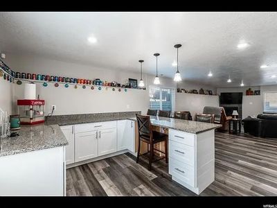 Granite Countertops & White Shaker Cabinets – Basement Kitchen Remodel