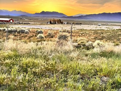 Improved 1 acre building lot.