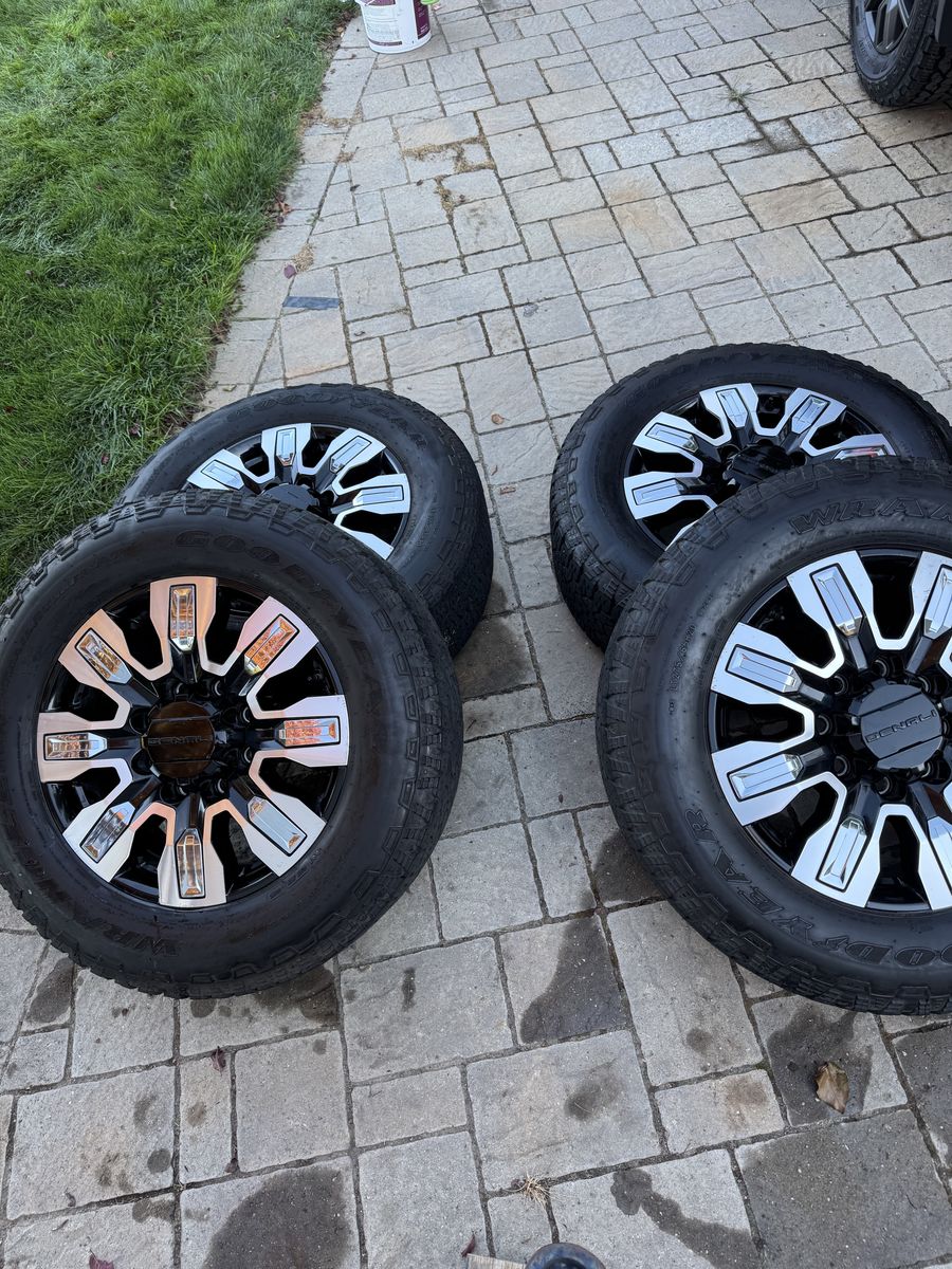 VERY LOW MILEAGE 275/65/20 Goodyear wrangler all terrain load range E tires on 20in OEM GMC rims