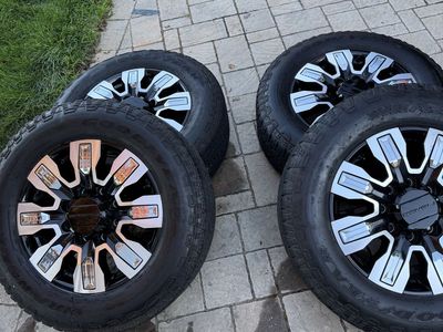 VERY LOW MILEAGE 275/65/20 Goodyear wrangler all terrain load range E tires on 20in OEM GMC rims