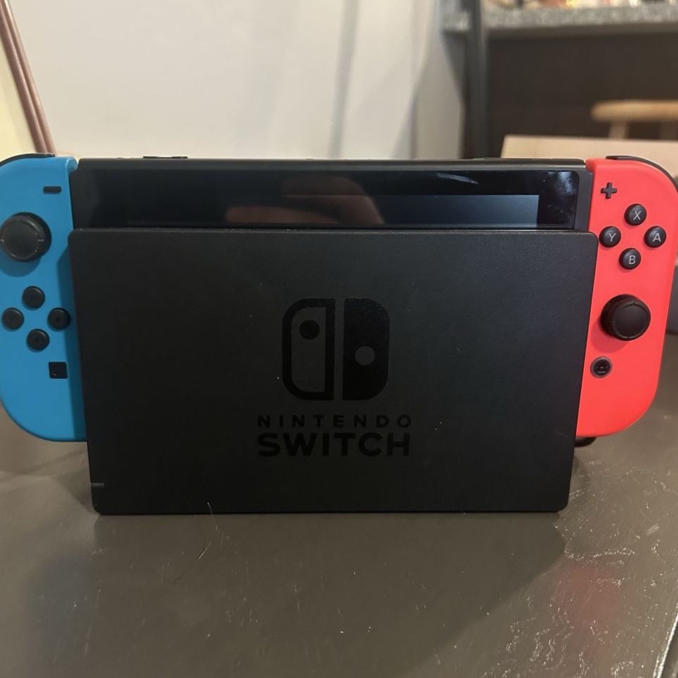 Nintendo switch console bundle w/dock, 2 joycons, carrying case, and charger cable. 