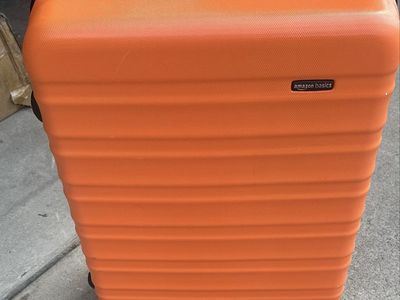 61” linear inches can be checked in on planes. Orange Hardside Spinner Luggage. Used like new