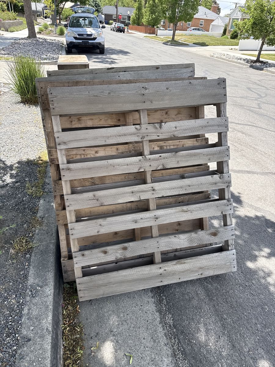 Free Stack of 4 Used Wood Pallets - Ideal for DIY Projects & Shipping