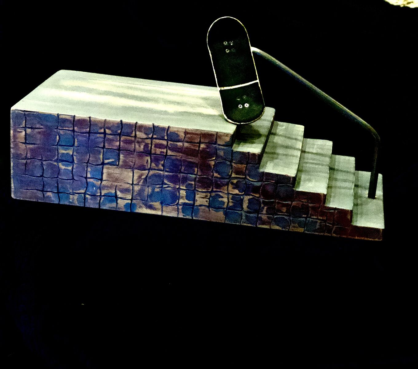 Fingerboard stair obstacle.