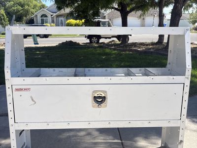 Van shelf with storage