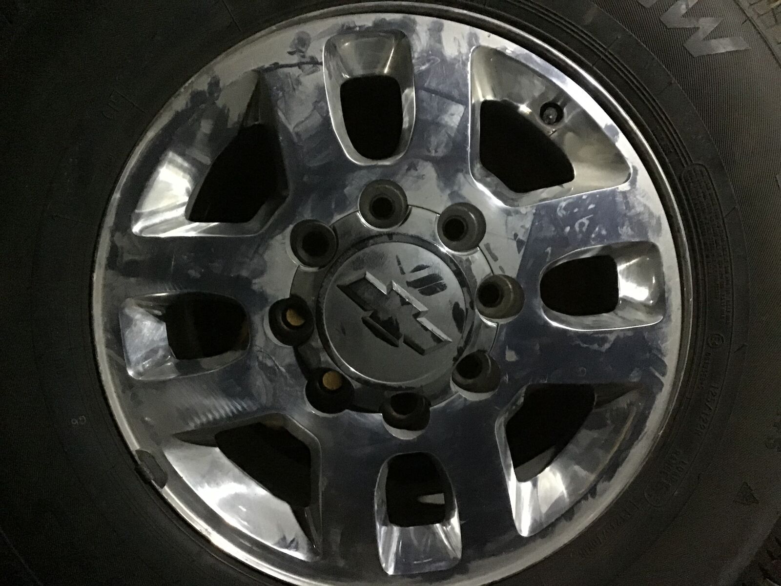 Silverado/sierra wheels with studded snow tires and TPMS sensors.