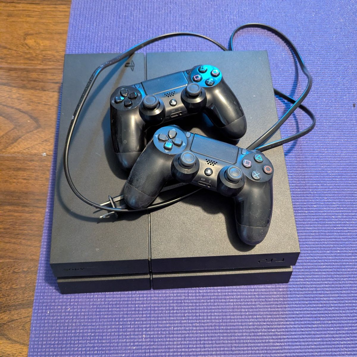 PS4 with 2 controllers and power cord