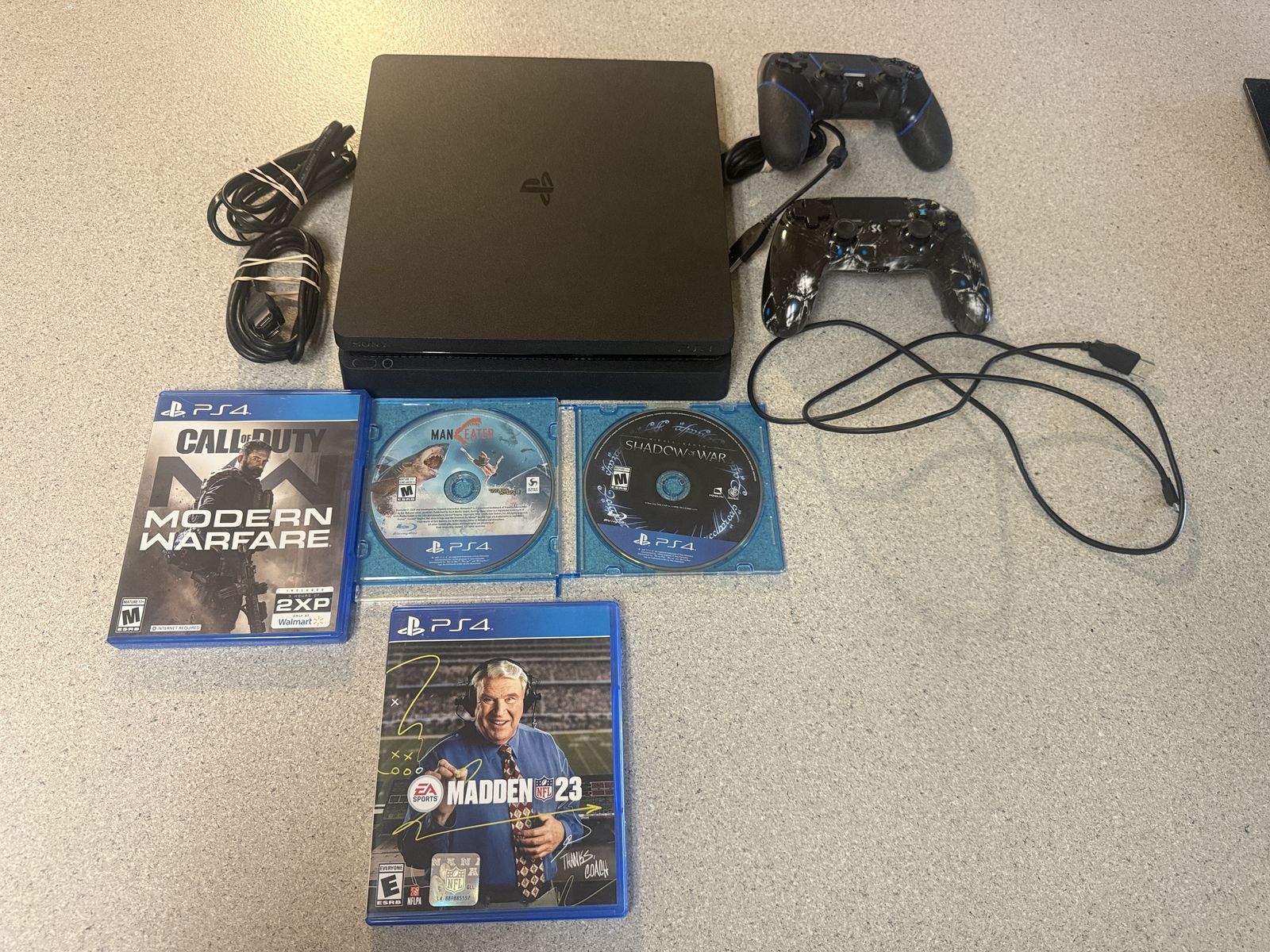 SLIM PS4 1TB WITH 4 GAMES AND 2 REMOTES