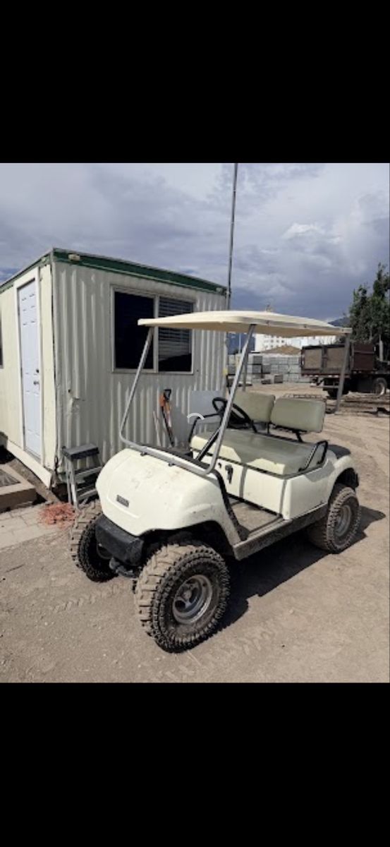 Yamaha Golf Cart with Off-Road Tires and Rear Utility 