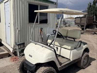 Yamaha Golf Cart with Off-Road Tires and Rear Utility