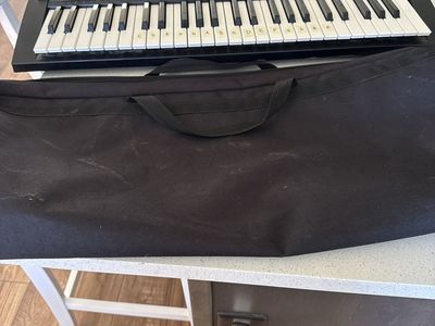Vintage LDS-50 Electronic Musical Keyboard with Soft Carrying Case, charger and music stand.