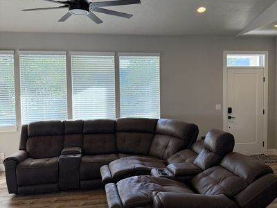 Comfortable Dark Brown Sectional Sofa with Recliners and Cupholders - Great for Living Room