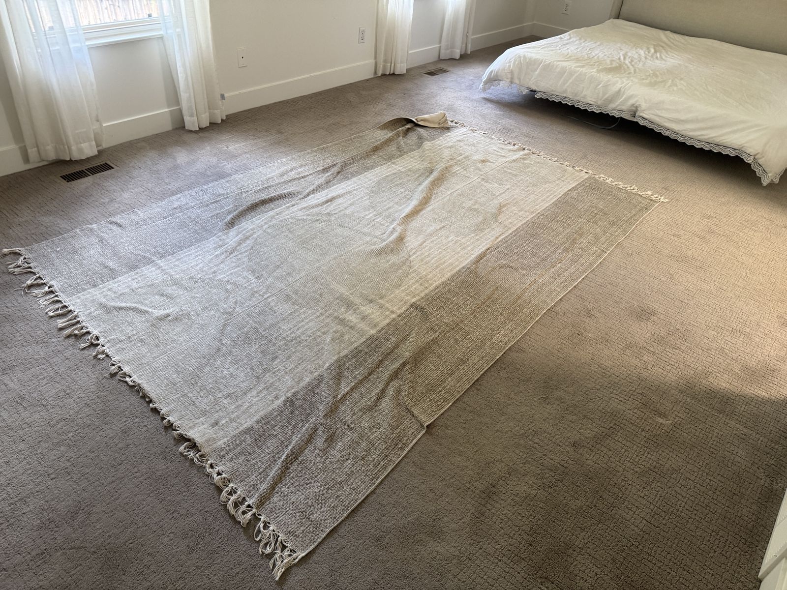 Couch, table, stools, beds, rug 
